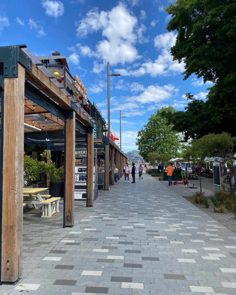 A photo showing the outside of Riverside Market in Christchurch, New Zealand. In the background you can see the Port Hills.