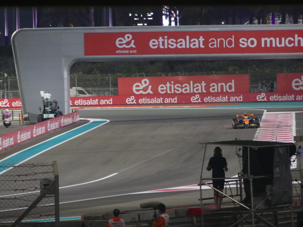 A photo of Lando Norris's McLaren out on the Yas Marina Circuit at the 2023 Grand Prix.