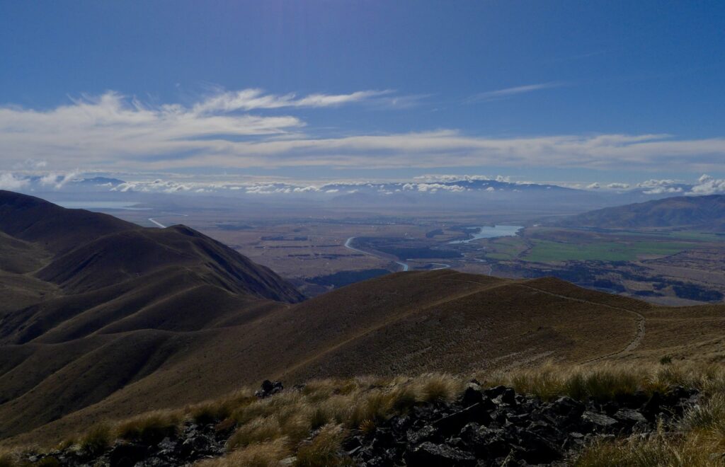 a hilly path showing the track from Ben Ōhau peak down to the greta stream walk.