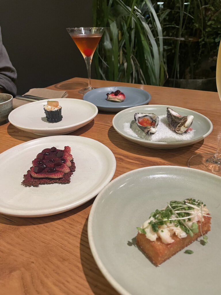 A table of food from the restaurant "Rātā". This is the first of seven courses on the tasting menu.