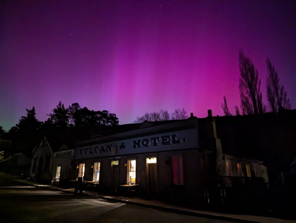 The Aurora Australis in Saint Bathans behind The Vulcan Hotel.